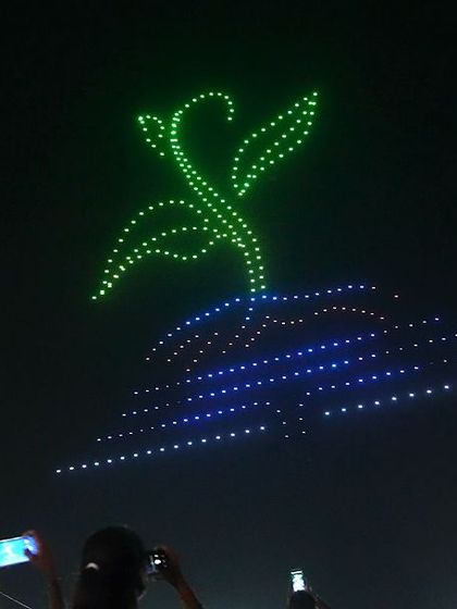 A sapling growing from the earth, a hopeful image from our water conservation drone show. We believe in using technology to inspire a sustainable future.