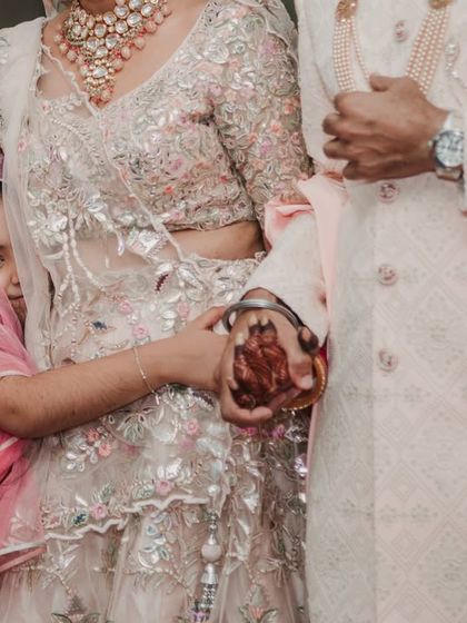 A touching moment as a little girl clings to the bride. Children often provide the most honest and heartwarming moments at a wedding.