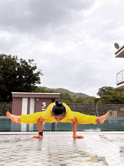 I am glad I left my corporate job for this. A powerful firefly pose, Tittibhasana, by the pool, feeling content and aligned with my passion.