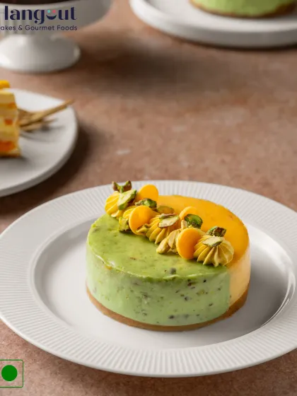 If summer had a flavor, it would be this Mango and Pistachio Cheesecake. The creamy, nutty pistachio base is the perfect complement to the sweet and tangy mango topping.