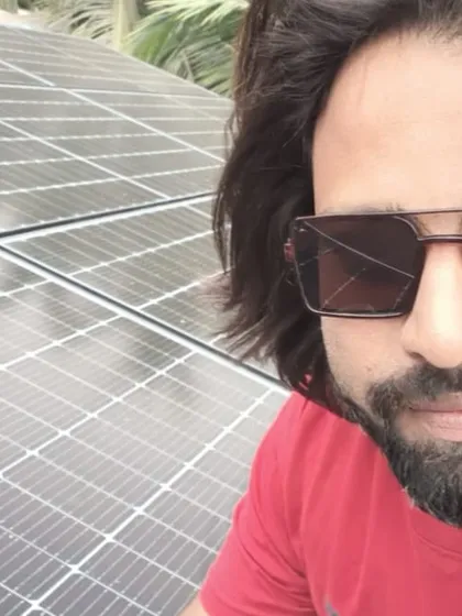 A proud customer with his new on-grid solar system in Dharwad, Karnataka. He is now generating his own electricity and significantly cutting down his monthly expenses.
