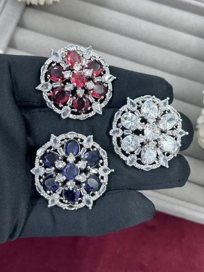 Our adjustable cocktail rings are a fast-moving item for any retailer. This video shows the variety of vibrant colors available, from ruby red to sapphire blue, all set in a floral AD Zircon design.
