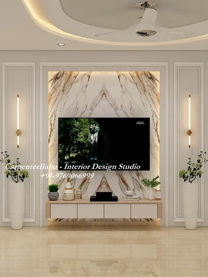 A symmetrical and grand TV unit design featuring a book-matched marble panel as the centerpiece. The tall vases and clean lines of the console give it a very stately and elegant appearance.