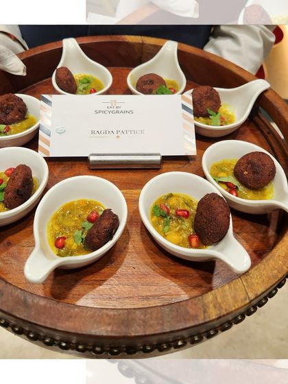 Ragda Pattice, deconstructed and served elegantly in individual spoons. This gourmet take on a beloved street food is perfect for passed appetizers at any upscale event.