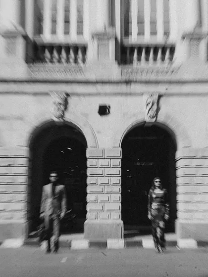An artistic, motion-blurred shot in black and white. This technique transforms a simple street scene into a dynamic and abstract piece of art, reflecting the fast pace of city life.