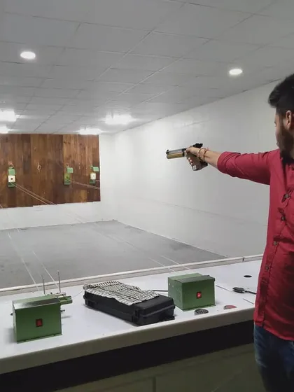 A participant focuses on his target during an adult recreational shooting session. This sport is an excellent way to improve concentration and relieve stress.