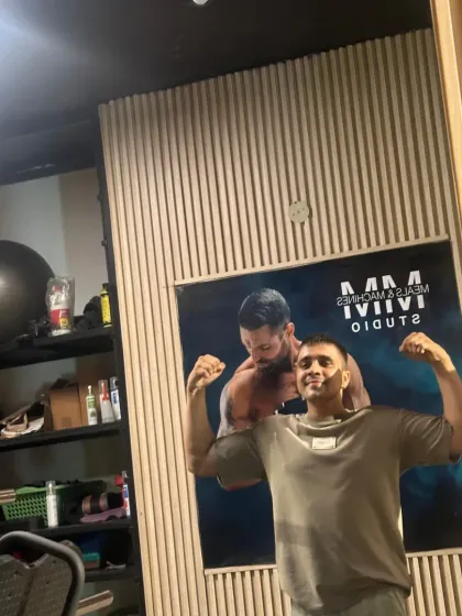 Another flexing pose, showing my dedication to strength.