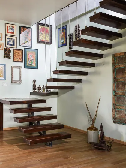 A staircase is more than just a way to get from one floor to another; it's a home's central sculpture. This custom-designed cantilevered staircase appears to float, creating a sense of lightness and open space. By using solid wood for the treads and a minimal support system, we turned a functional element into a striking piece of structural art.
