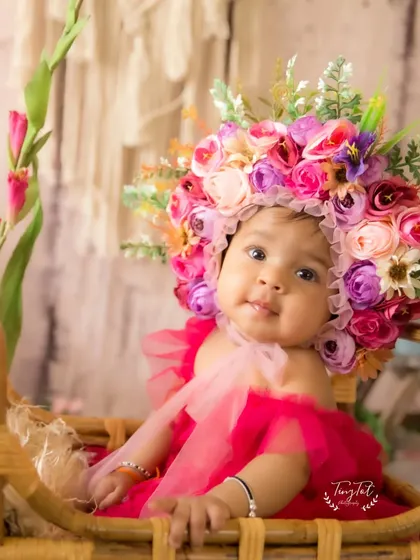 A sweet and gentle portrait from a floral-themed sitter session, capturing a calm moment.