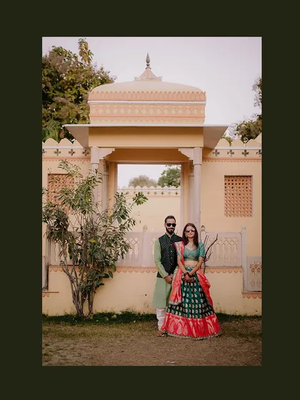 A beautiful couple portrait from a Mehendi ceremony at the stunning Amar Mahal in Orchha. The heritage architecture provides a perfect royal backdrop for this destination wedding event.