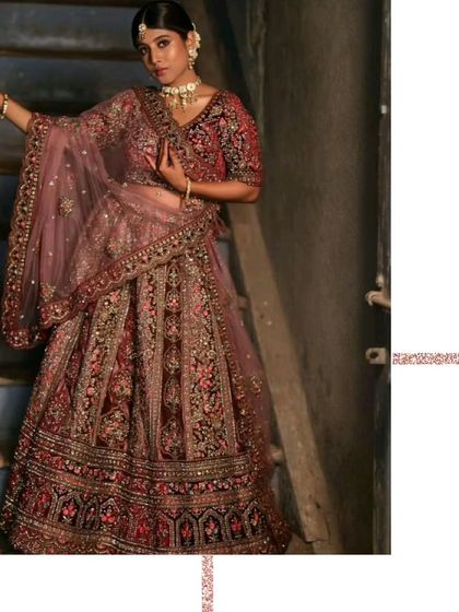 A full-length view of the deep wine-colored bridal lehenga. The detailed embroidery on the skirt and blouse makes it a truly special piece for your wedding day.