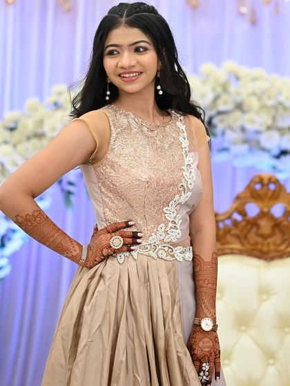 This guest's elegant gown is perfectly complemented by her detailed party mehendi.