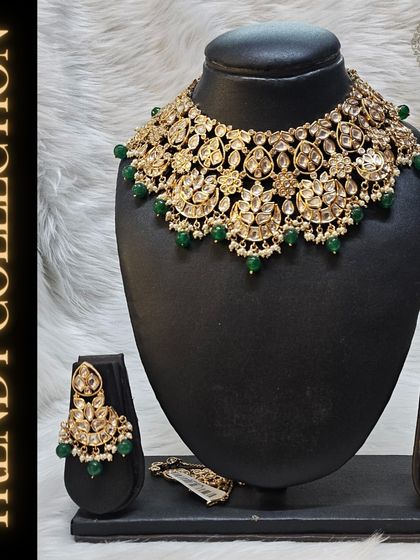 This trendy Kundan set with green beadwork is a perfect example of our elegant collection. Rent it for your next event and enjoy a new look without the commitment.