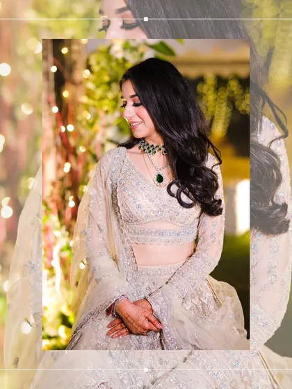 A serene portrait of the bride at her reception. Her gentle smile and the soft, warm lighting create a look of pure elegance.