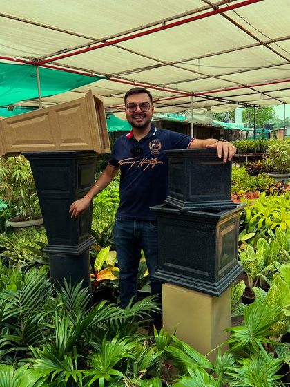 A look at my grand Tulsi planters placed amongst lush greenery. These are designed to give the holy basil plant the prominence it deserves in your home.