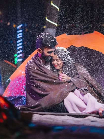 A magical moment during a night camping theme. We used artificial snow to create this cozy, winter-wonderland feeling, even next to a warm bonfire.