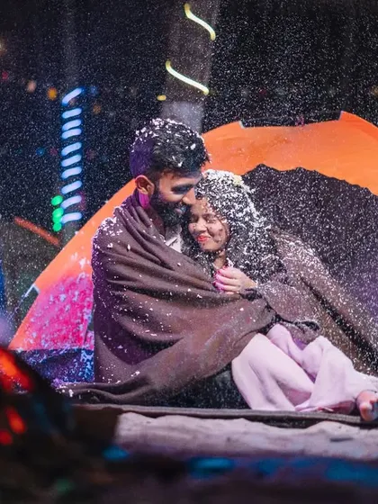 A magical moment during a night camping theme. We used artificial snow to create this cozy, winter-wonderland feeling, even next to a warm bonfire.