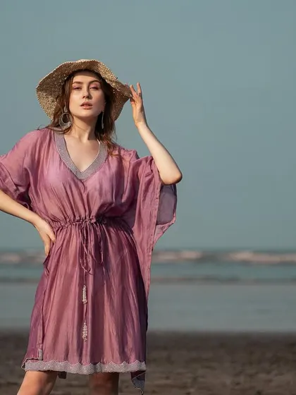 The model looks effortlessly chic in the purple kaftan and straw hat, a perfect example of my resort wear styling.