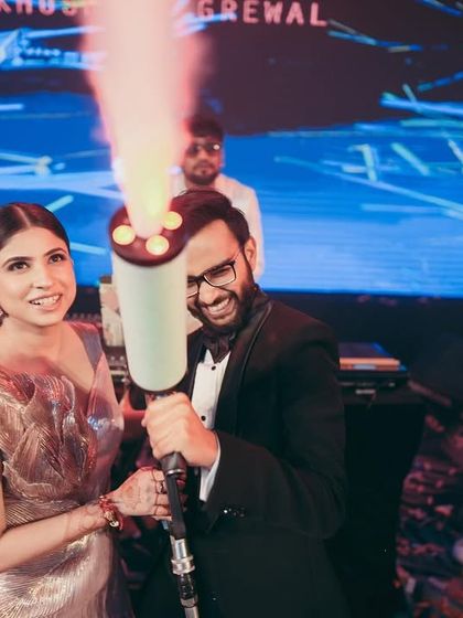 A fun moment with a smoke gun on the dance floor. It's all about creating a look that is both beautiful and durable enough for a high-energy party.