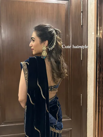 A closer look at the hairstyle for my navy blue velvet sharara. A chained hair accessory can add a touch of glamour to a simple ponytail for a wedding event.