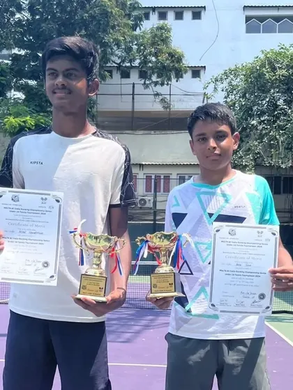 Aarya Patkar and his doubles partner with their runner-up trophies from the CS7 Series tournament.