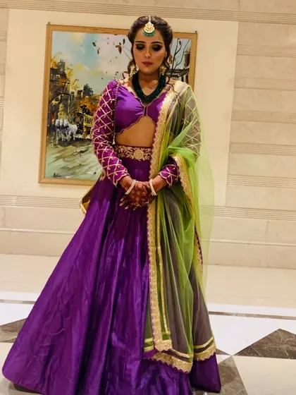 A full view of a bridesmaid look I styled for myself. The vibrant purple lehenga paired with a lime green dupatta and traditional jewelry creates a striking color combination that stands out beautifully at any wedding.