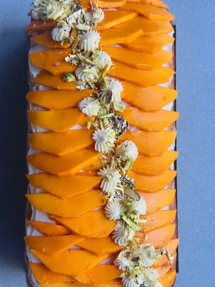 When mango season arrives, I make this stunning Mango Tea Cake. It's a buttery, moist cake topped with cream, fresh mango slices, and edible gold leaf for a touch of luxury.