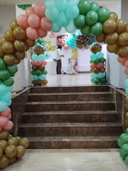 A roaring good time at this dinosaur-themed birthday party! This grand balloon arch in earthy tones of green, brown, and pink created a prehistoric gateway to fun for the little explorer's big day.