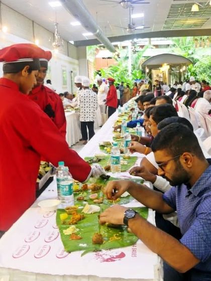 A guest enjoying a delicious meal served on a banana leaf. The happiness of my clients and their guests is the biggest reward for me.