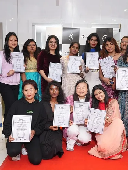 A group of proud graduates holding their certificates at our HRBR Layout launch event. This is what success looks like, and we celebrate every student's achievement.