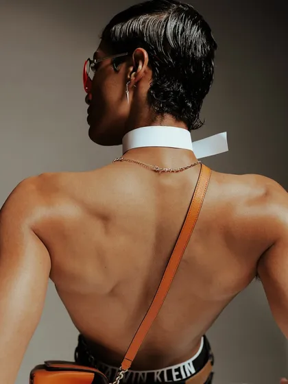 A detailed close-up from the Calvin Klein shoot, drawing attention to the accessories and the contrast between skin and fabric.