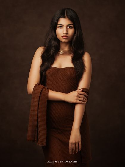 A slightly different angle, showing the soft waves of her hair and the texture of her dress. Every detail contributes to the painterly feel.