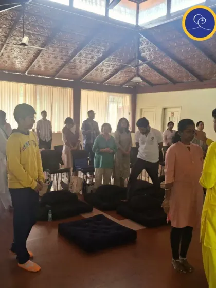 Another view of our purification ceremony, where devotees stand with hearts open to receive blessings. This ceremony is a regular part of our services, helping us to continually renew our spiritual aspirations.
