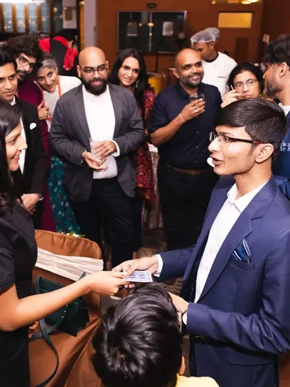 Performing a card trick for a group of guests in Bangalore. The focus and curiosity in their eyes is what I aim for.