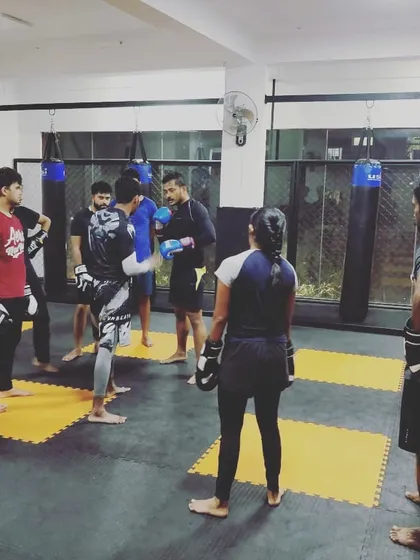 Here I am giving instructions during a kickboxing class. We train as a group, so everyone can learn from each other's questions and progress.