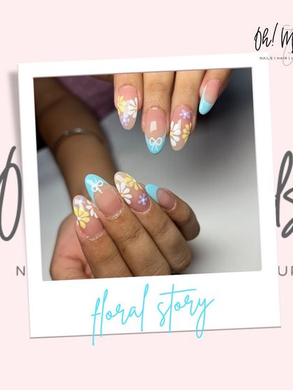 A sweet and delicate floral story. This design features a sheer base with hand-painted daisies in yellow, white, and purple, complemented by baby blue French tips and a tiny bow accent.