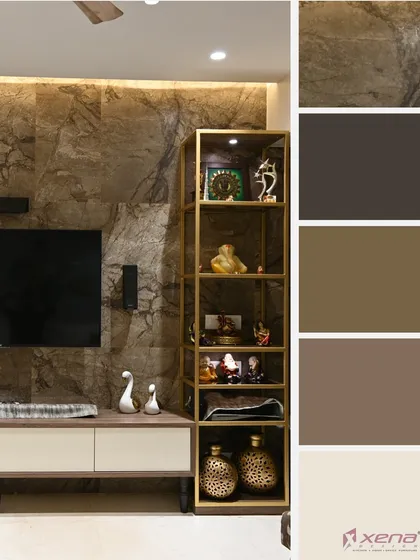 An earthy and warm TV unit design. The stone-textured wall panel creates a rustic feel, which is balanced by the clean lines of the white and wood console and the sleek, gold-finished metal display shelf.