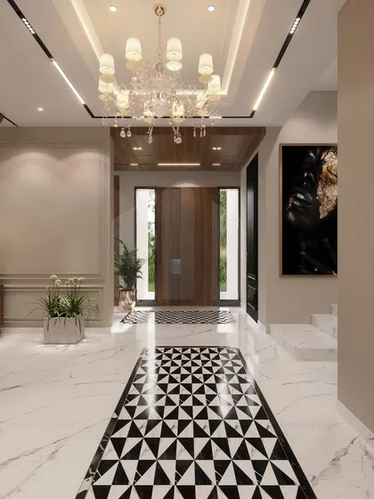 This perspective of the grand entrance foyer highlights the seamless flow we create between spaces. The geometric flooring leads the eye through the home, past elegant chandeliers and curated art, promising a journey through a beautifully designed residence.