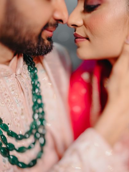An extreme close-up, artistic shot of a couple, focusing on their features and the intimacy of the moment.
