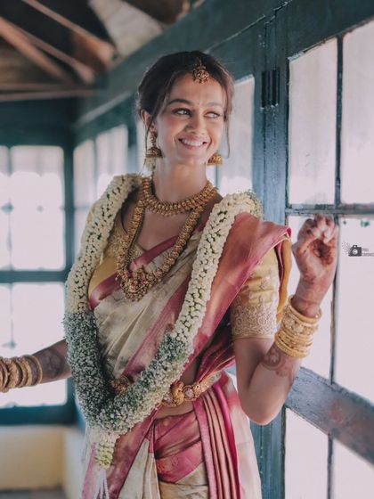 Another beautiful portrait of the bride by the window, radiating joy.