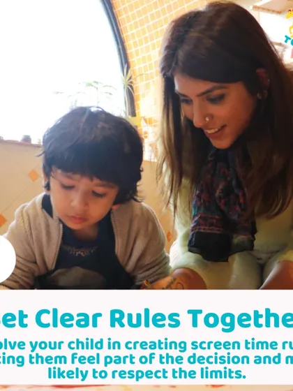 A parent and child working on a craft together. I encourage families to set clear rules about screen time together, making it a team effort.