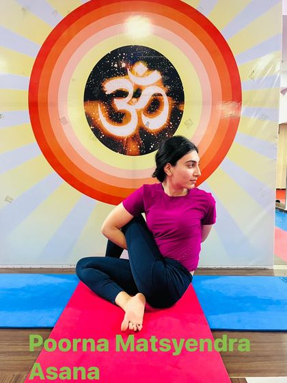 Poorna Matsyendrasana (Full Lord of the Fishes Pose), the advanced version of the spinal twist, requiring deep flexibility in the hips and spine.