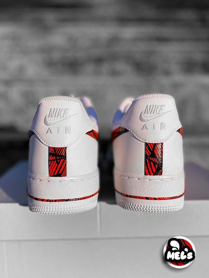 A rear shot of the pair of MotoGP custom Nikes, showing the matching heel designs.