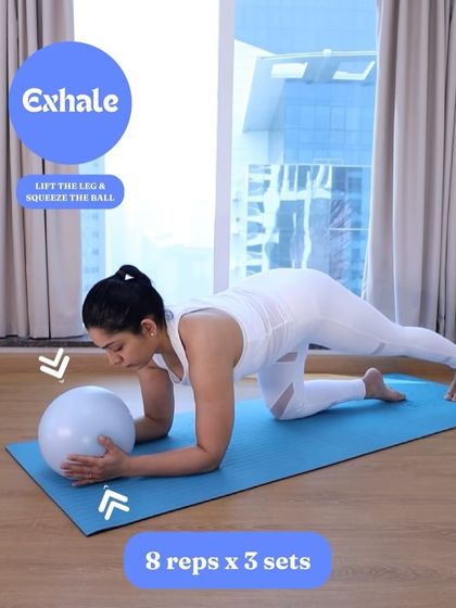 This modified bird dog, using a ball for tactile feedback, helps you strengthen your entire core while protecting your back. Exhale as you lift the leg and squeeze the ball.