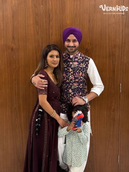 A lovely family photo with the little one dressed in a comfortable and stylish printed kurta, showing that our outfits are perfect for any family gathering.