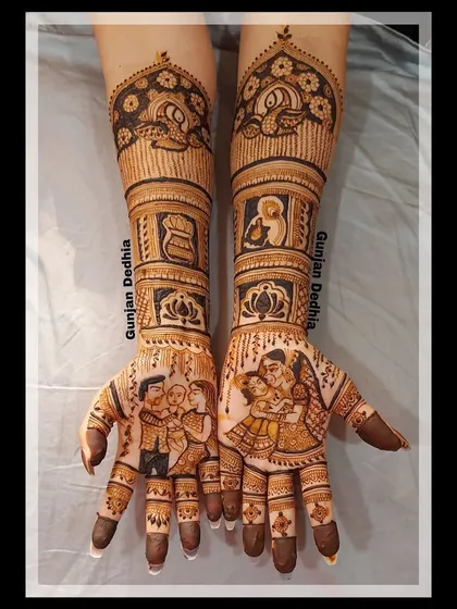 This intricate design was created for a Mundan ceremony, featuring family portraits and auspicious symbols to celebrate the special occasion.