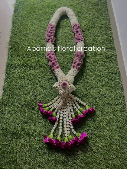 I also create unique, intricately woven Thai-style garlands. The detailed craftsmanship and pattern make this a standout piece, perfect for a special occasion or as a unique varmala.
