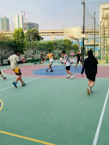 A player dribbles down the court, looking to initiate the offense.