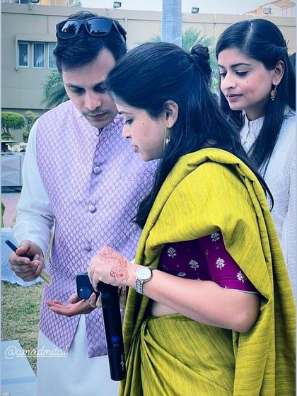 The first step is just to start. Guests at a family gathering begin to add color to a large collaborative canvas.