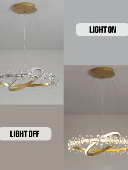 A modern crystal ring chandelier, shown both off and on. You can see how the crystals catch the light to create a sparkling, glamorous effect.